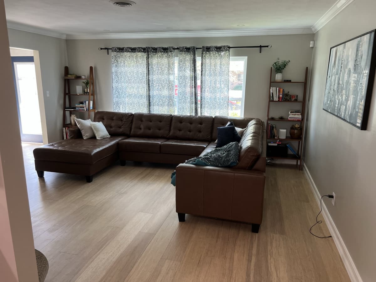 Whole-home renovation by Karhan — finished living room with hardwood, Orlando area